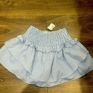 Trendy blue striped mini skirt with attached shorts